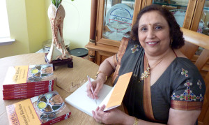 Bhanu Hajratwala signs copies of her book 