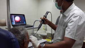Dr Subbaiah performs an endoscopic swallowing assessment on a patient.